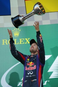 Sebastian Vettel tosses his trophy in Japan