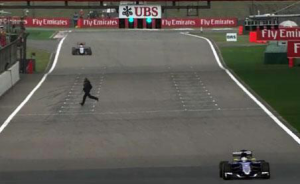 Spectator runs across track in second practice session for Chinese Grand Prix