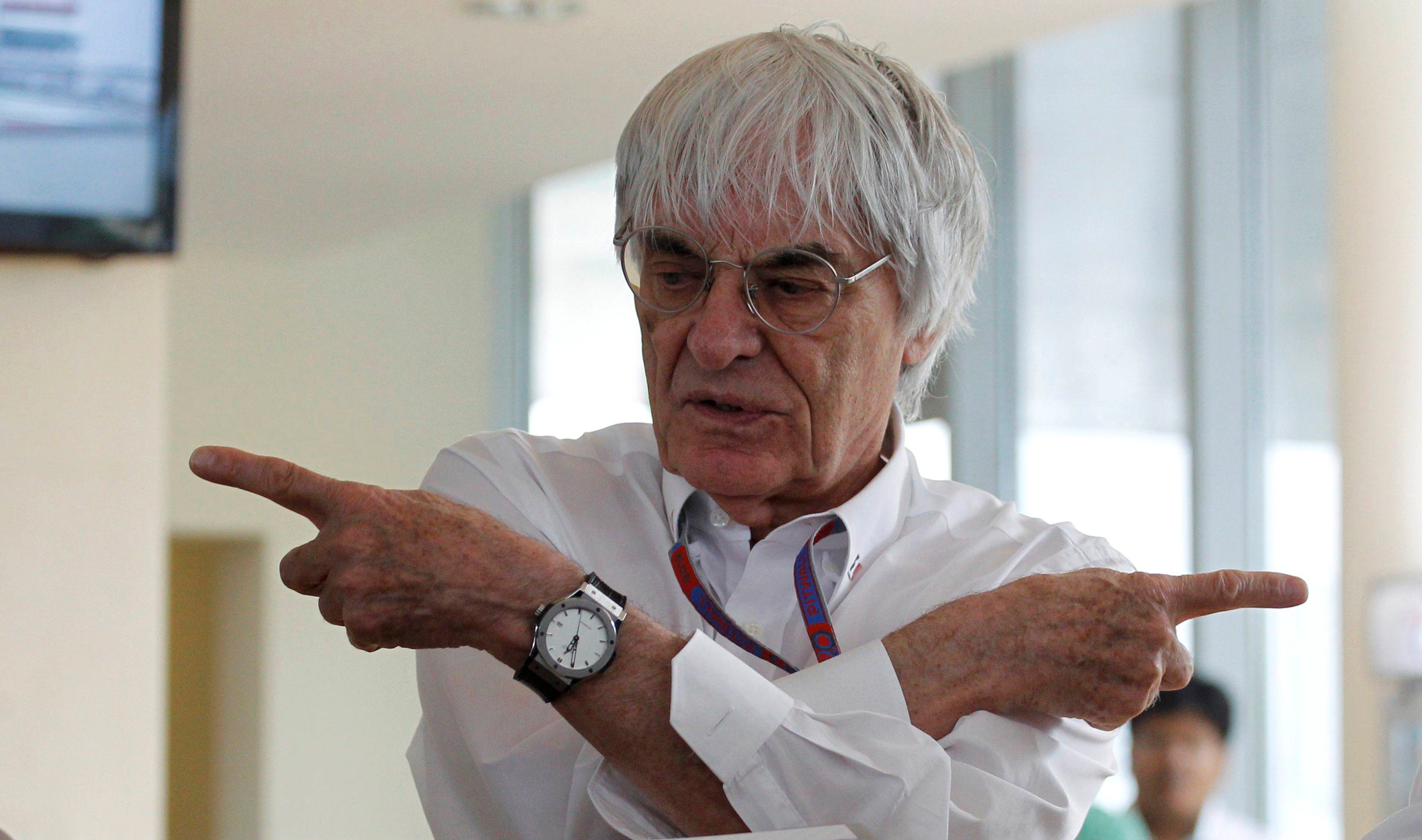 Formula One supremo Bernie Ecclestone gestures during the presentation of a commemorative book presented to him on the occasion of his birthday at the Indian F1 Grand Prix at the Buddh International Circuit in Greater Noida
